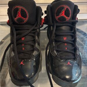 Kids Black and Red Nike Jordan sneakers